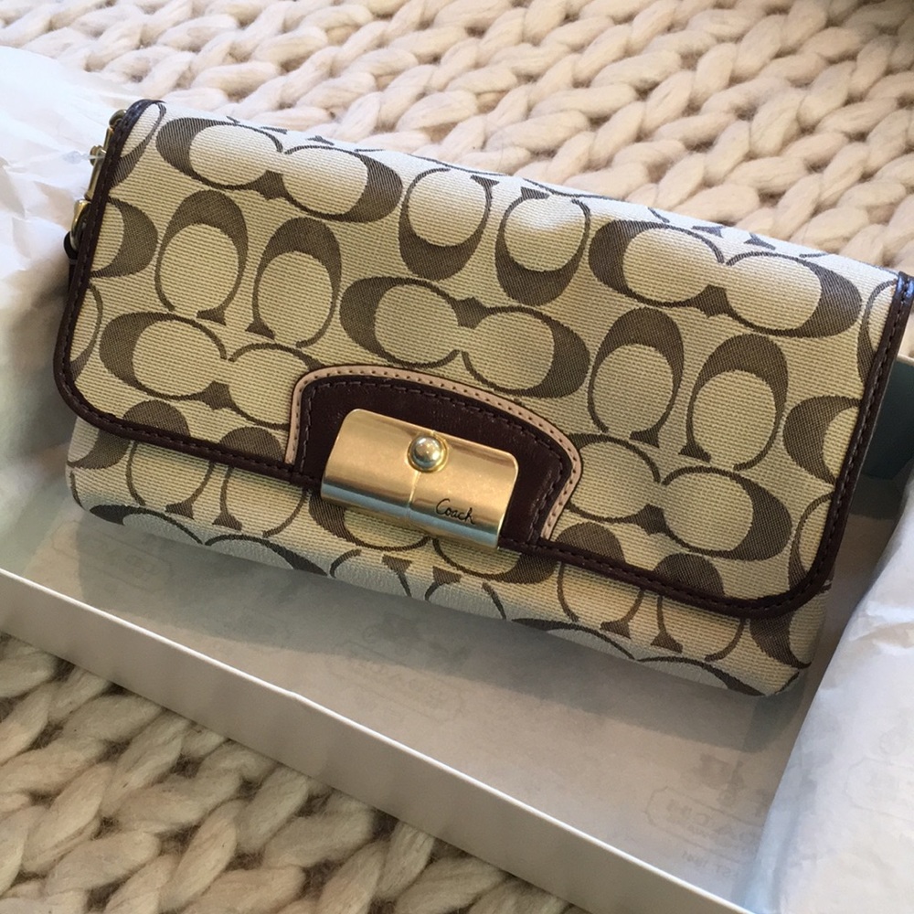 Brand-new Coach wristlet, with tag and gift box